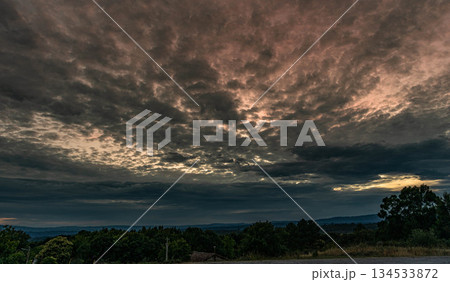 Dramatic and Cloudy Sky Over the Countryside Dramatic and Cloudy Sky Over the Countryside 134533872