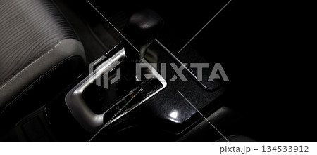 Car gear. Close up of modern car automatic gear selector or electronic shifter. Premium interior design EV car gears driving control. auto transmission modes. Automotive technology in motion driving. 134533912