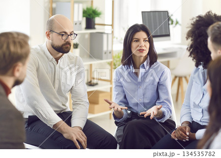 Group of business people talking on a meeting at the working place in office. 134535782