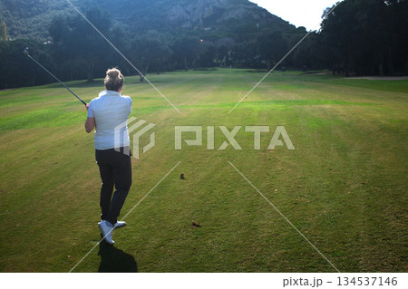 woman playing golf in the green fairway club 134537146