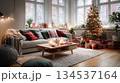Cozy living room decorated for Christmas eve with a lit tree and wrapped gifts. A beautifully decorated space at home with a Christmas tree, presents, and a warm,This is AI-generated item 134537164