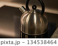 Tea pot in a stove 134538464