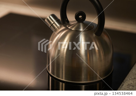 Tea pot in a stove Tea pot in a stove 134538464