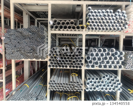 Stacked metal pipe steel tube construction material industrial storage warehouse building supply metal texture round pipe Stacked metal pipe steel tube construction material industrial storage warehouse building supply metal texture round pipe 134540558