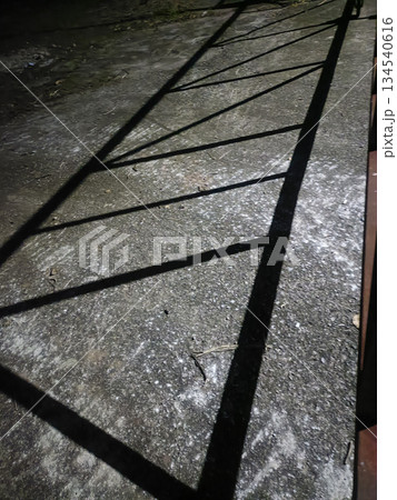 Shadow pattern night diagonal line shadow metal fence shadow concrete texture ground abstract urban geometry moody street Shadow pattern night diagonal line shadow metal fence shadow concrete texture ground abstract urban geometry moody street 134540616