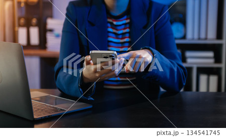 Businesswoman hand using smart phone laptop and tablet with social network Businesswoman hand using smart phone laptop and tablet with social network 134541745
