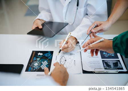 Medical technology network team meeting concept. Doctor hand working with smart phone modern digital tablet and laptop computer 134541865