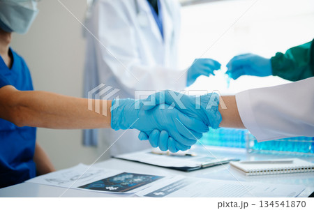 Doctor handshake and partnership in healthcare, medicine or trust for collaboration, unity or support.Team of medical experts shaking hands 134541870
