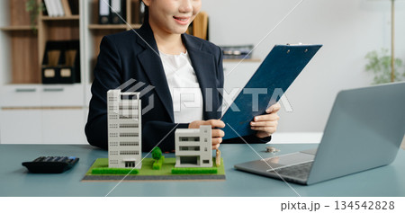 Considering buying a home, investing in real estate. Broker signs a sales agreement. agent, lease agreement, successful deal Considering buying a home, investing in real estate. Broker signs a sales agreement. agent, lease agreement, successful deal 134542828