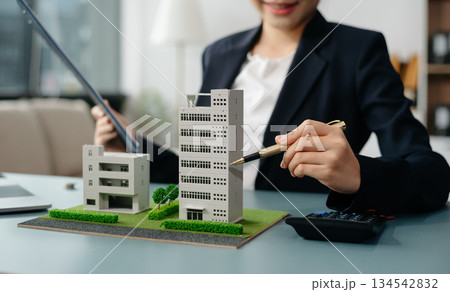 Considering buying a home, investing in real estate. Broker signs a sales agreement. agent, lease agreement, successful deal 134542832