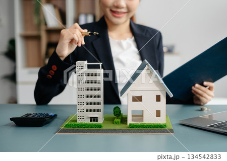 Considering buying a home, investing in real estate. Broker signs a sales agreement. agent, lease agreement, successful deal Considering buying a home, investing in real estate. Broker signs a sales agreement. agent, lease agreement, successful deal 134542833