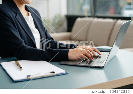 businesswoman hand working with new modern computer using on smartphone and tablet as concept businesswoman hand working with new modern computer using on smartphone and tablet as concept 134542836