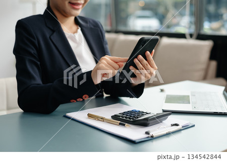 businesswoman hand working with new modern computer using on smartphone and tablet as concept businesswoman hand working with new modern computer using on smartphone and tablet as concept 134542844