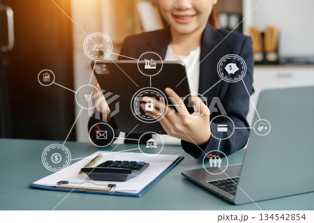 Busineswoman analyzing sales data and economic growth graph financial, solution analysis and development contents on table 134542854