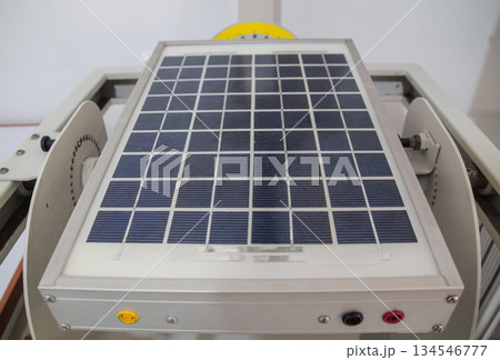 Detailed shot of a small scale PV solar panel array utilized for research and development testing on a mechanical tilt rig. 134546777