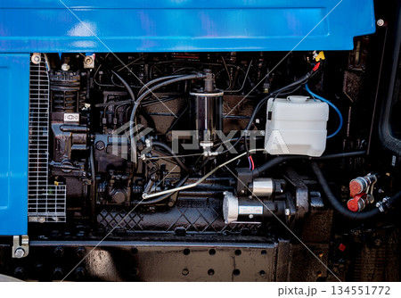Modern new agricultural tractor engine. Machinery and equipment Modern new agricultural tractor engine. Machinery and equipment 134551772