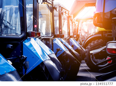 Rows of modern tractors. Industrial details. Agricultural 134551777