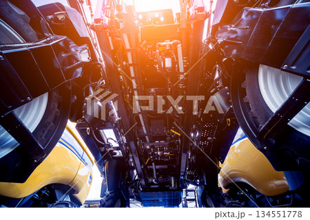 Modern agricultural machinery and equipment. Yellow agricultural harvester. 134551778