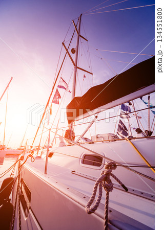 View of harbor with yachts details. Beautiful sunset sky in the marina bay. View of harbor with yachts details. Beautiful sunset sky in the marina bay. 134551800