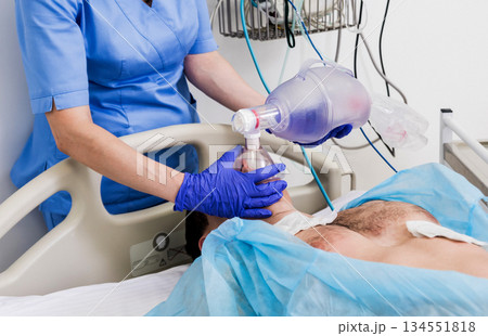 Doctors give resuscitation to a male patient in the emergency room. 134551818