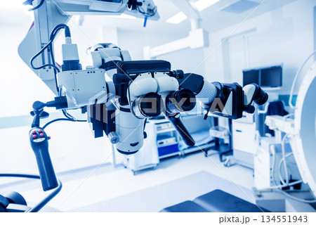 Modern microscope for operations in surgery room at the hospital. Modern microscope for operations in surgery room at the hospital. 134551943