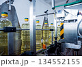 Bottling line of sunflower oil in bottles. Vegetable oil production plant 134552155