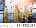 Bottling line of sunflower oil in bottles. Vegetable oil production plant 134552158