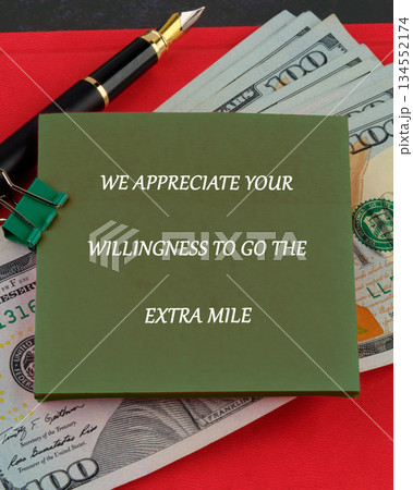 Olive note stating gratitude, accompanied by US currency, a pen, and a green paper clip on a red surface. Conveys a message of recognition and value for exceeding expectations Olive note stating gratitude, accompanied by US currency, a pen, and a green paper clip on a red surface. Conveys a message of recognition and value for exceeding expectations 134552174