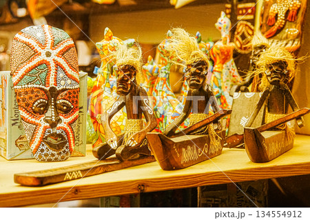 Tribal Shaman Statues in Boat with Ritual Mask Tribal Shaman Statues in Boat with Ritual Mask 134554912