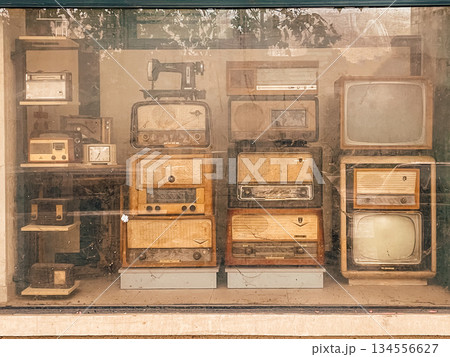 curated collection of antique radios and tvs evoking sense of heritage and nostalgia in interior decor 134556627