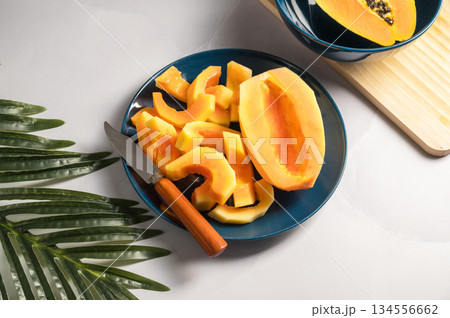 Papaya exotic fruits on plate. Healthy vegan food. Papaya exotic fruits on plate. Healthy vegan food. 134556662