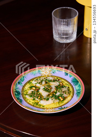 Closeup View Of Herb Oil Garnished With Microgreens And Delicate Textured Cheese For Editorial Food Story 134556693