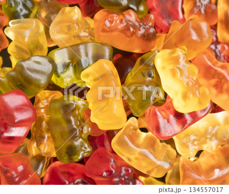 Macro shot assorted colorful gummy candies. Top view candy pattern. Jelly bears background texture. 134557017