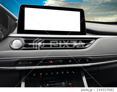 Monitor in car with isolated blank screen use for navigation maps and GPS. With clipping path. Car detailing. Car display with blank screen. Modern car black leather interior details. 134557081