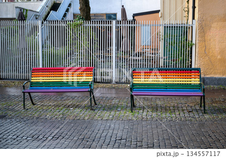 Rainbow painted benches symbolizing LGBTQ pride on urban street Rainbow painted benches symbolizing LGBTQ pride on urban street 134557117