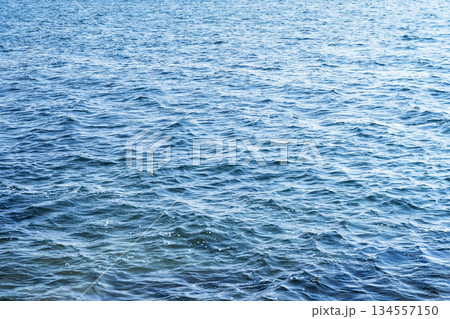 Aerial view of a crystal clear sea water texture. View from above Natural blue background. Blue water reflection. Blue ocean wave. Summer sea. Drone. Top view Aerial view of a crystal clear sea water texture. View from above Natural blue background. Blue water reflection. Blue ocean wave. Summer sea. Drone. Top view 134557150