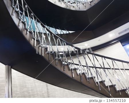 Modern stairs in loft interior. Interior with stairs. Straight staircase with railings Modern stairs in loft interior. Interior with stairs. Straight staircase with railings 134557210