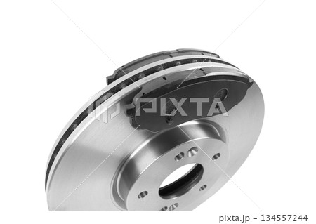Brake discs and brake pads isolated on white background. Auto parts. Brake disc rotor isolated on white. Braking disk. Car part. Car detailing. Spare parts. 134557244