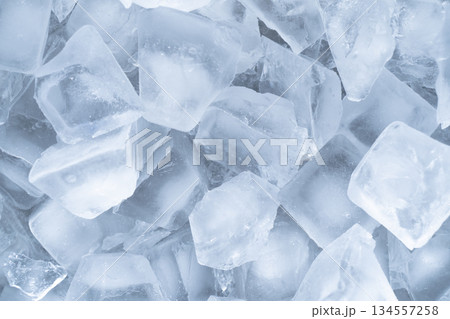 Ice cubes background texture. Background with ice cubes pattern. Macro shot 134557258