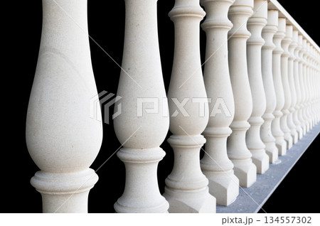 Stonework. Element of a stone interior staircase. Srone baluster close-up view. Handmade baluster for the stairs. Home exterior details Stonework. Element of a stone interior staircase. Srone baluster close-up view. Handmade baluster for the stairs. Home exterior details 134557302