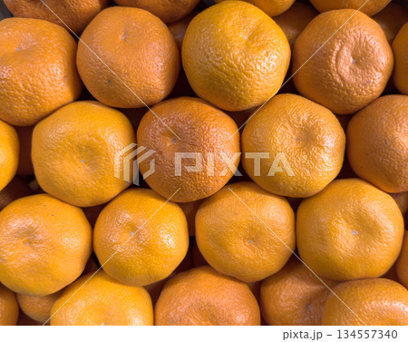 Mandarin texture background. Juicy and fresh mandarine pattern 134557340