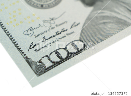 Macro shot image of the corner of a 100 dollar bill banknotes. Concept of financial success. Background of 100 dollar bills. One hundred dollars. Macro shot image of the corner of a 100 dollar bill banknotes. Concept of financial success. Background of 100 dollar bills. One hundred dollars. 134557373