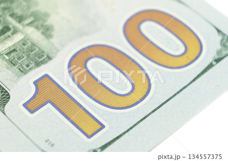Macro shot image of the corner of a 100 dollar bill banknotes. Concept of financial success. Background of 100 dollar bills. One hundred dollars. Macro shot image of the corner of a 100 dollar bill banknotes. Concept of financial success. Background of 100 dollar bills. One hundred dollars. 134557375