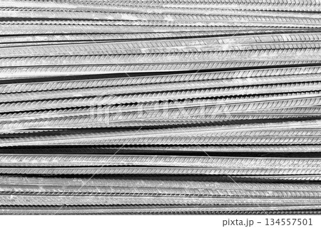 Steel bar or steel reinforcement bar. Construction armature. Reinforcements steel bars in row. The steel rebars. Steel rods bars texture background. Steel bar or steel reinforcement bar. Construction armature. Reinforcements steel bars in row. The steel rebars. Steel rods bars texture background. 134557501