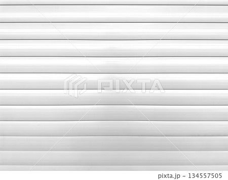 Roller shutter gate. Metal roller garage door as background. Automatic electric roll-up garage gate. Garage with white rolling gates. Roller shutter gate. Metal roller garage door as background. Automatic electric roll-up garage gate. Garage with white rolling gates. 134557505