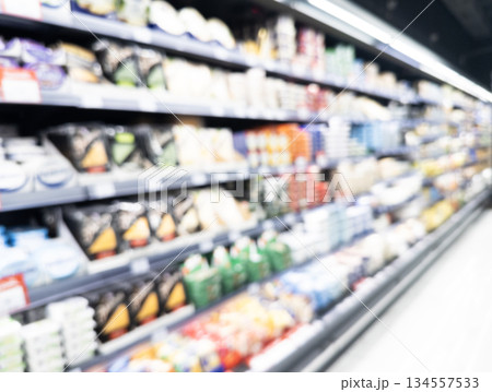 Blurred background with supermarket. Blur background of supermarket interior with shopping cart. Hall or shopping center mall with blurred lights background 134557533