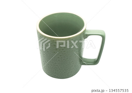 Green ceramic cup isolated on a white background. Empty ceramic cup Green ceramic cup isolated on a white background. Empty ceramic cup 134557535