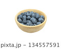 Ripe sweet blueberry. Fresh blueberries isolated on white background. Macro shot texture of blueberry berries in wooden cup. Blueberry berries pattern close up 134557591