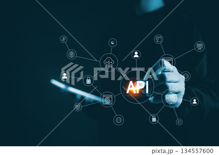 Business hand touching API connection interface digital network icons representing application programming interface system integration cloud services data exchange modern backend technology solutions Business hand touching API connection interface digital network icons representing application programming interface system integration cloud services data exchange modern backend technology solutions 134557600
