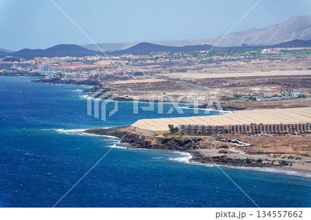 Greenhouses on coast near Tenerife airport, sunny summer day, Canary Islands, Spain Greenhouses on coast near Tenerife airport, sunny summer day, Canary Islands, Spain 134557662
